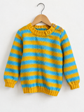 A children's knit sweater with horizontal yellow and light blue stripes, hanging on a wooden hanger against a plain white wall. The sweater has a crew neck, ribbed cuffs and hem, and two wooden buttons at the collar.